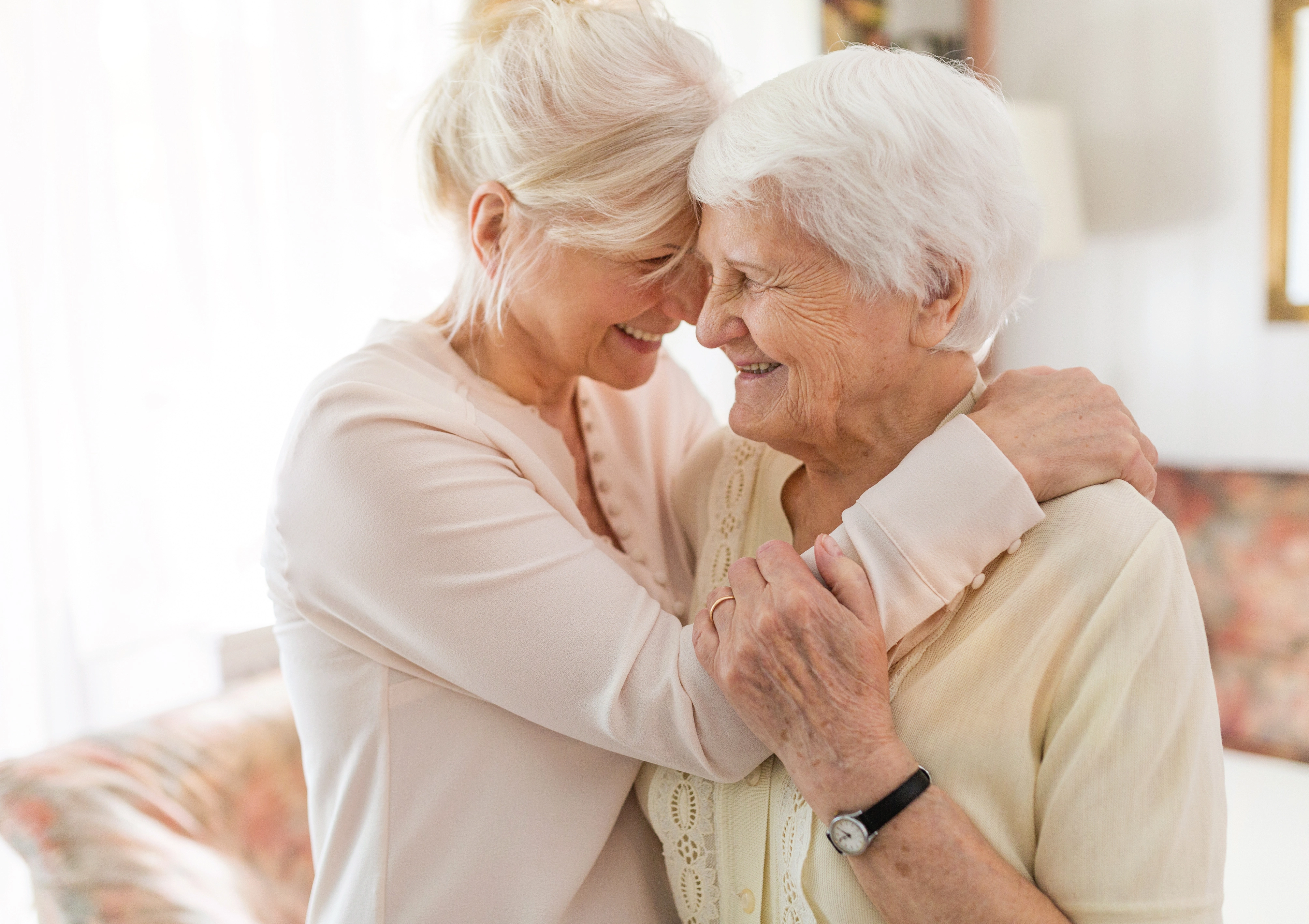 elderly women hugging