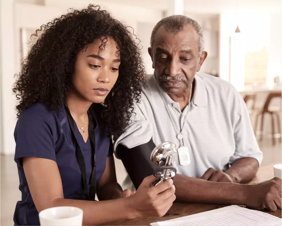 nurse taking patient's blood pressure