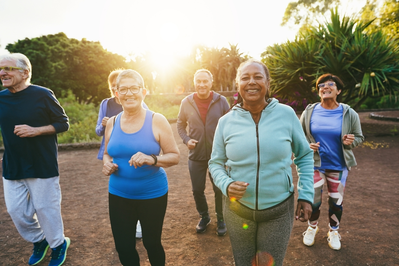 group of senior adults jogging outdoors