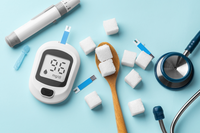 blood glucose monitor, stethoscope, and sugar cubes