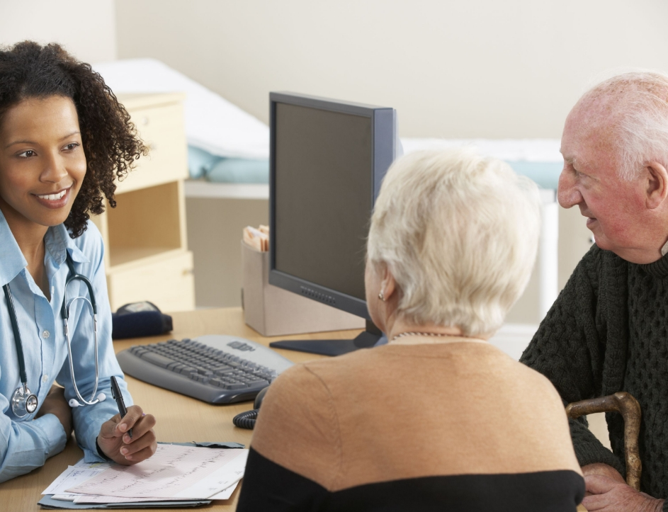 pharmacist talking to older patients 